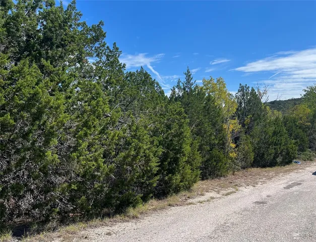 a view of a road with a yard