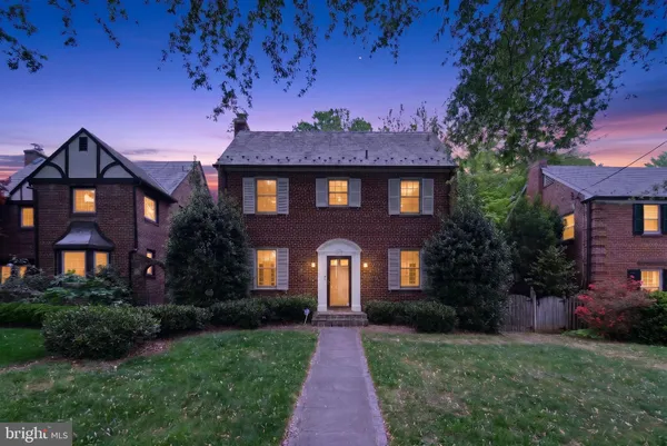 a front view of a house with yard