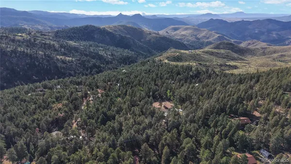 a view of mountains and valleys