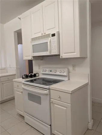 a bathroom with a sink toilet tub and shower