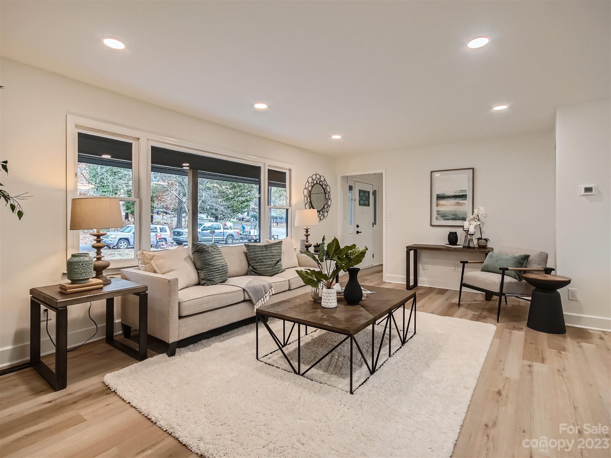 7201 Leaves Lane Charlotte, NC 28213 - Photo 11 of 29 a living room with furniture and wooden floor