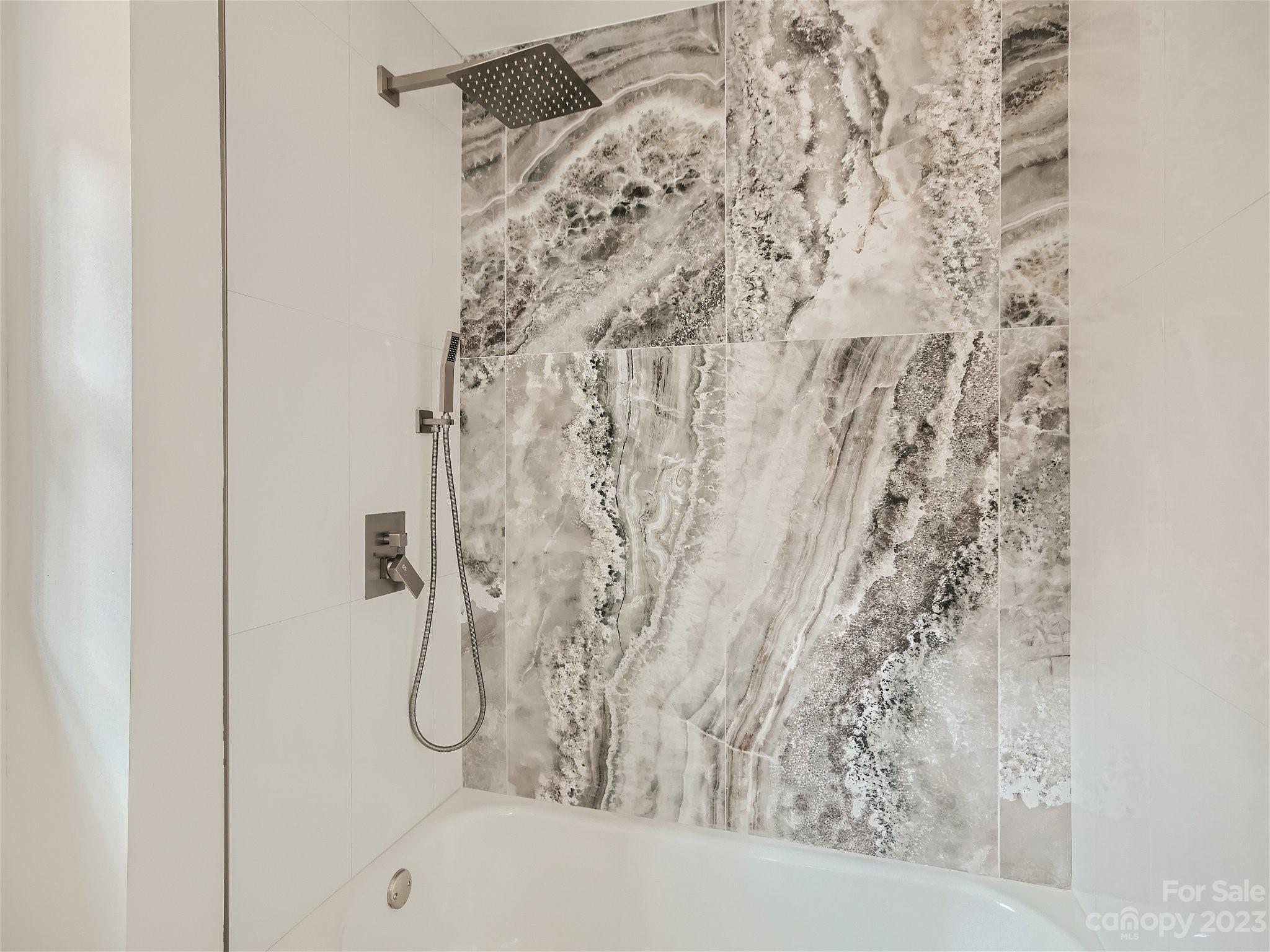 7201 Leaves Lane Charlotte, NC 28213 - Photo 14 of 29 a bathroom with a shower curtain