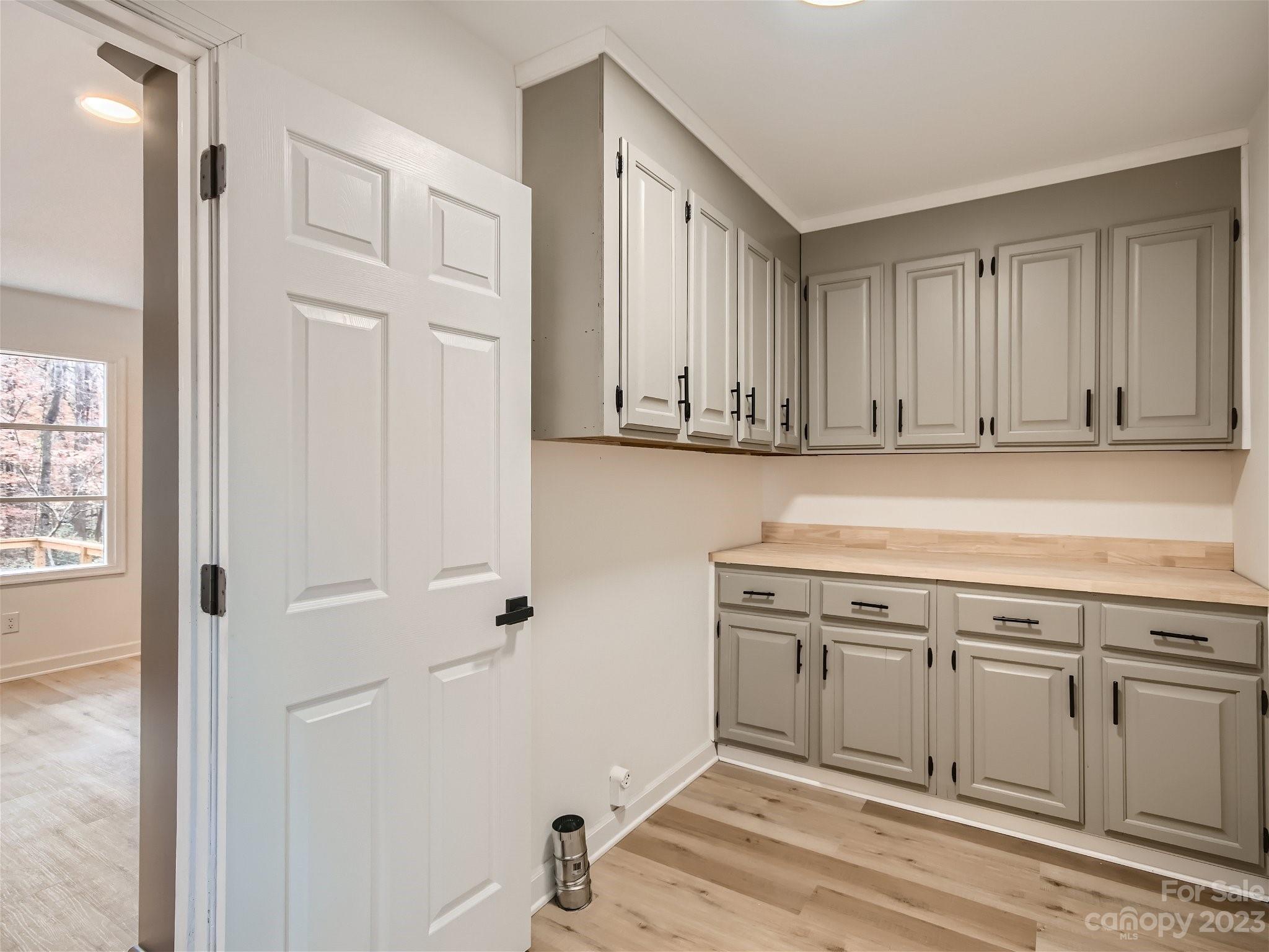 7201 Leaves Lane Charlotte, NC 28213 - Photo 16 of 29 a view of a kitchen with white cabinets