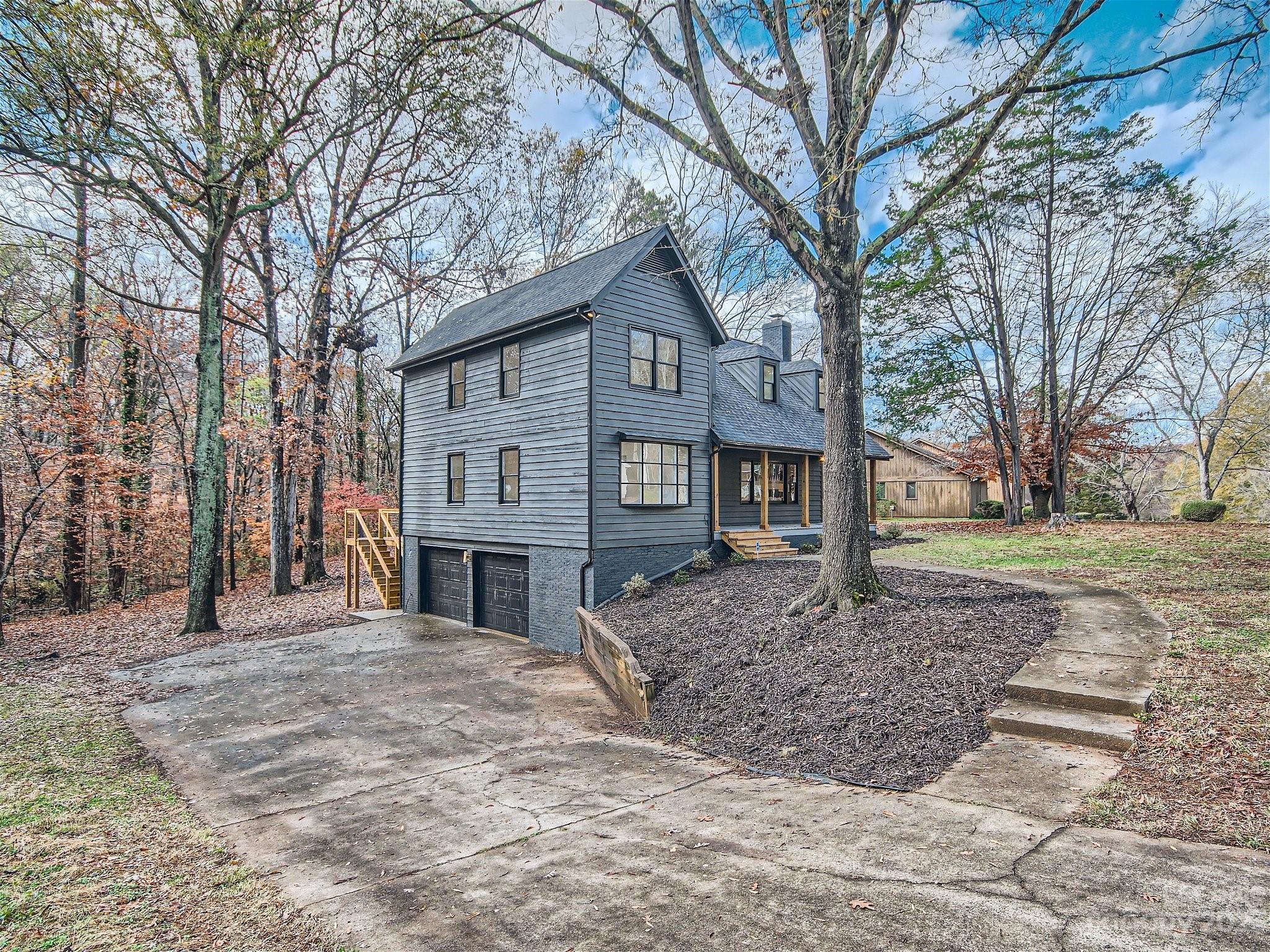 7201 Leaves Lane Charlotte, NC 28213 - Photo 21 of 29 a front view of a house with a yard