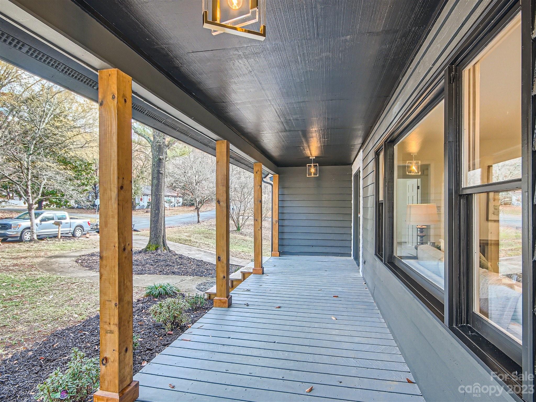 7201 Leaves Lane Charlotte, NC 28213 - Photo 4 of 29 a view of a balcony with wooden floor
