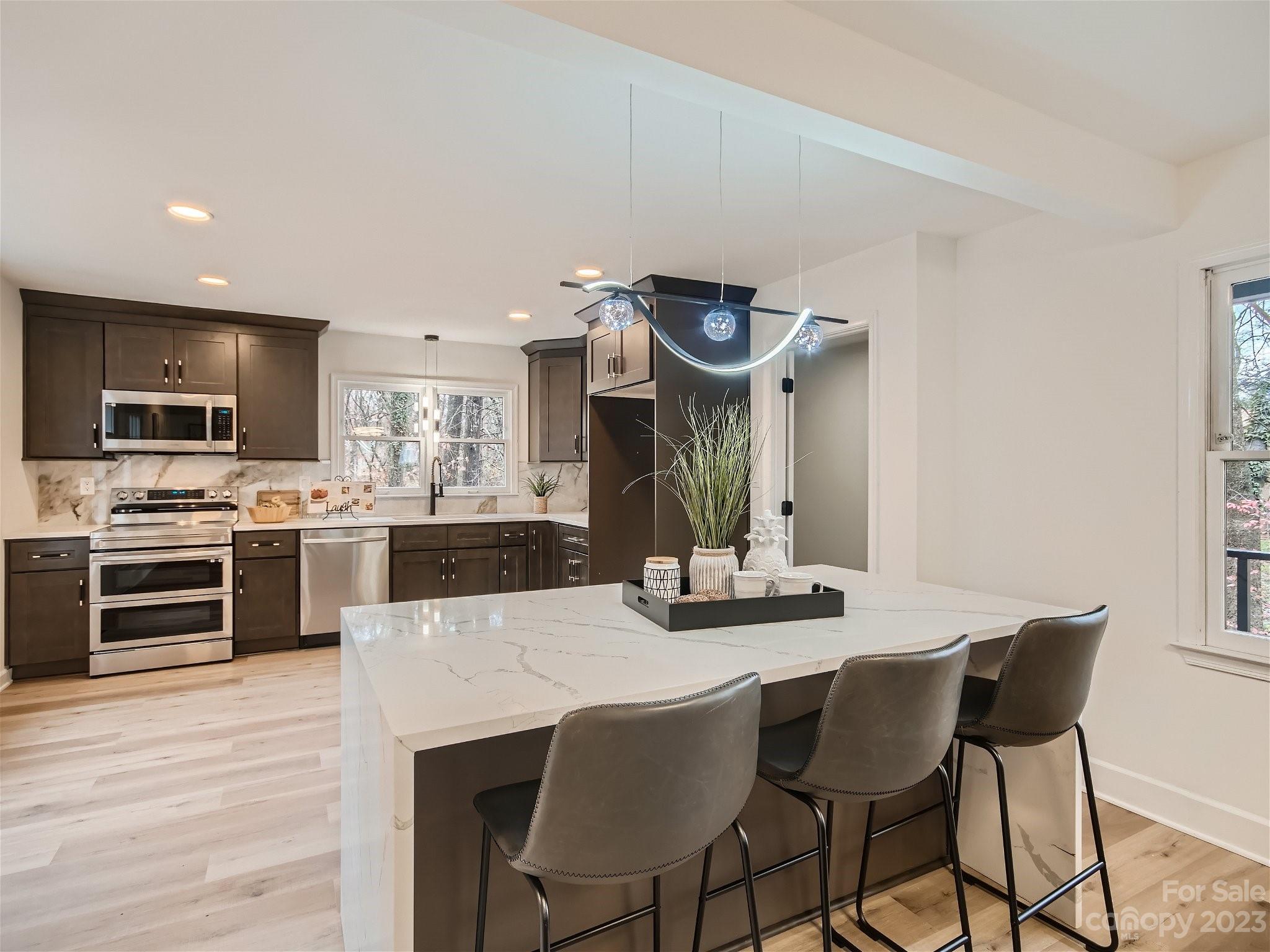 7201 Leaves Lane Charlotte, NC 28213 - Photo 8 of 29 a view of a dining room with furniture and wooden floor