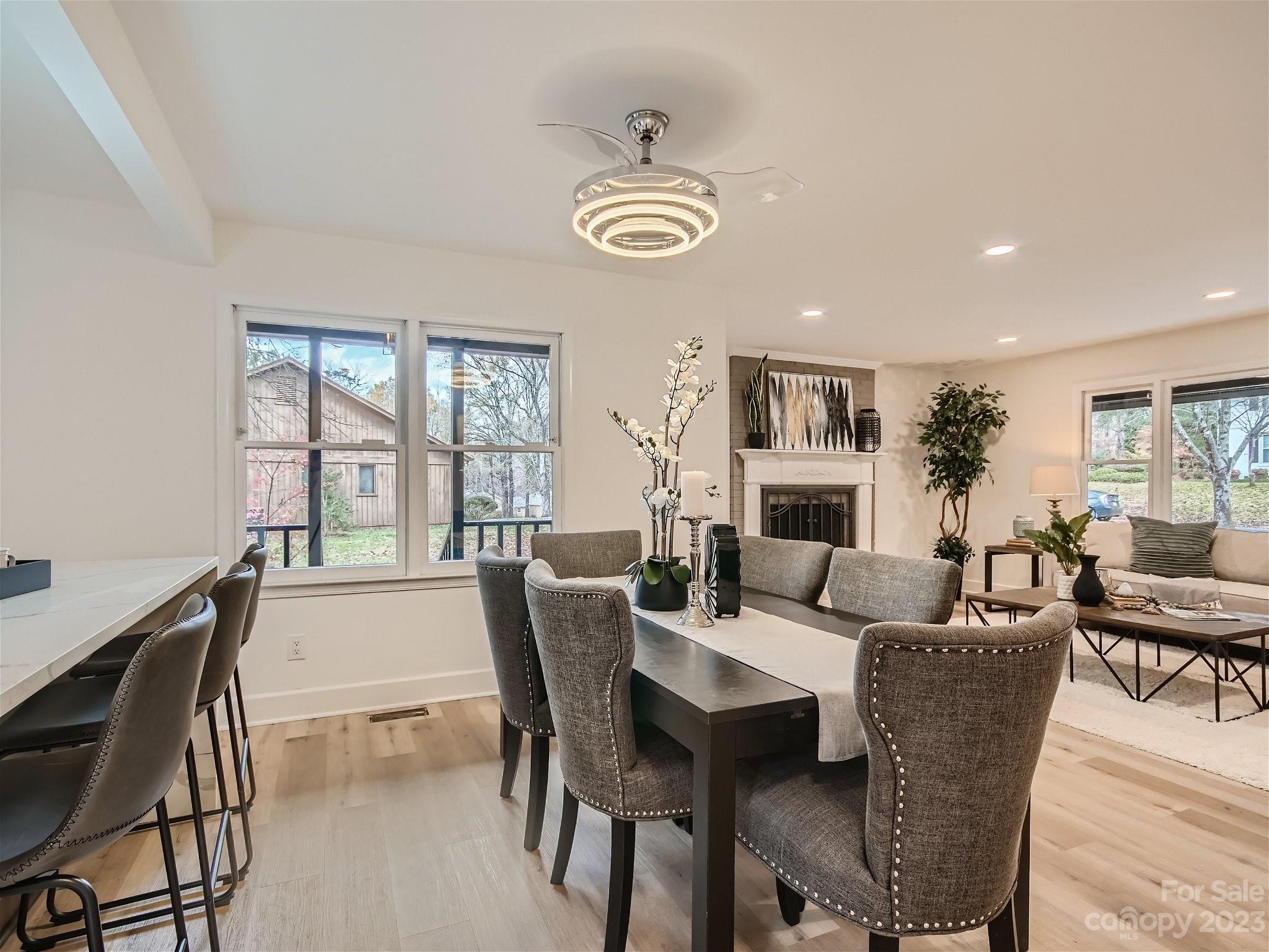 7201 Leaves Lane Charlotte, NC 28213 - Photo 9 of 29 a view of a dining room with furniture window and wooden floor