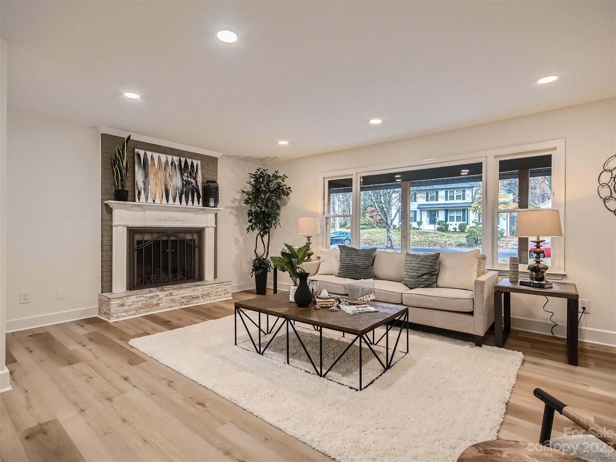 7201 Leaves Lane Charlotte, NC 28213 - Photo 10 of 29 a living room with furniture and a fireplace