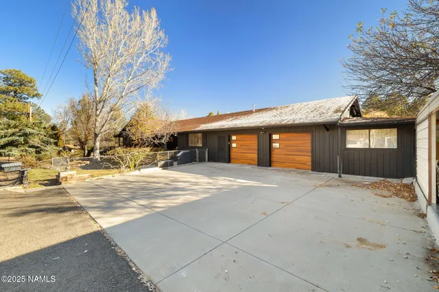 a living room with furniture chess board and a couch