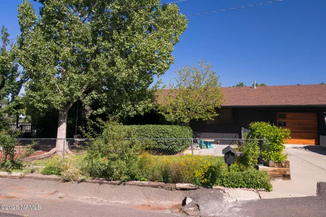 a kitchen with stainless steel appliances granite countertop sink stove top oven and cabinets