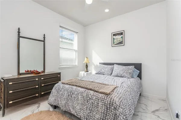 a bedroom with a bed and a dresser