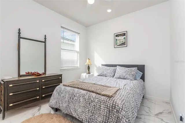 a bedroom with a bed and a dresser