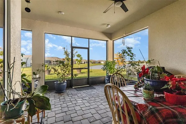 a view of a dining room with furniture window and outside view