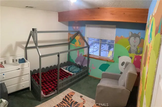 a room with toys and a rug