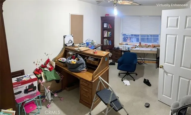 a living room with furniture and a dining table