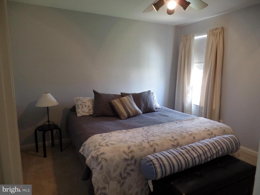 15 Wabash Road Inwood, WV 25428 - Photo 22 of 30 a bedroom with a bed and a lamp