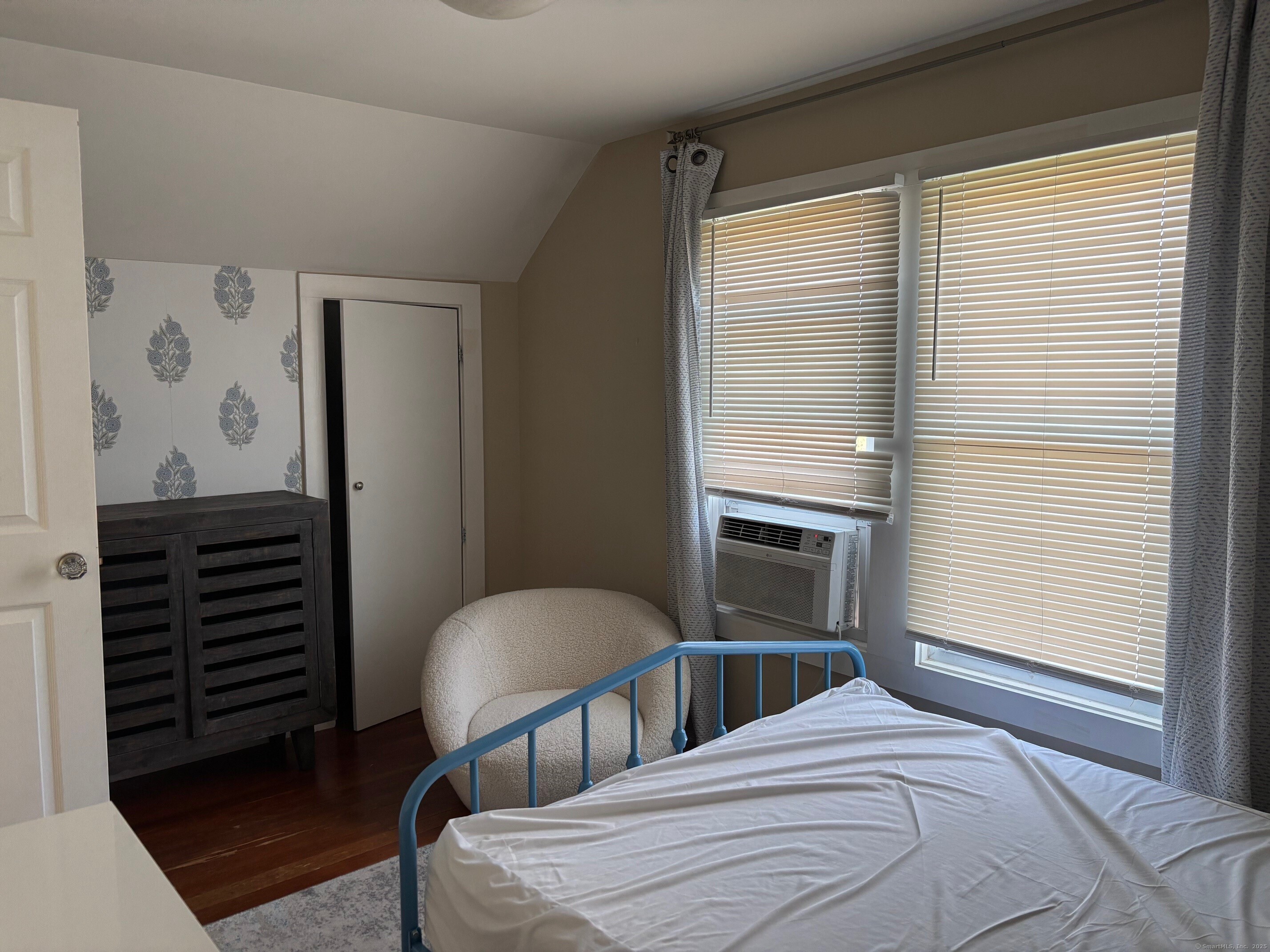 799 Rowland Road Fairfield, CT 06824 - Photo 13 of 15 a bedroom with a bed next to a window