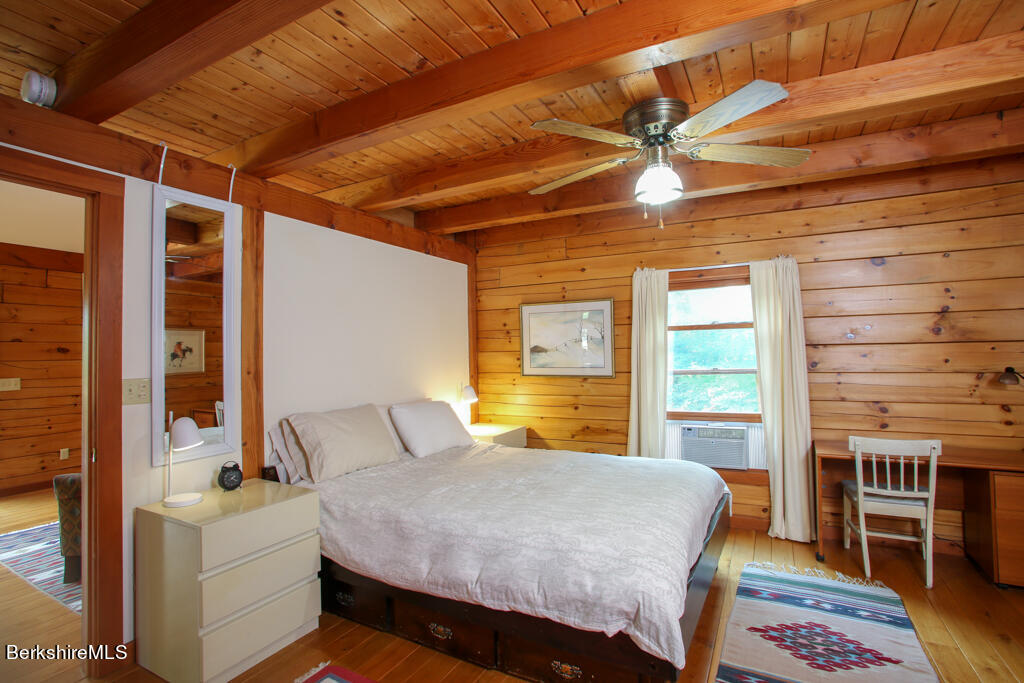 7 Mary Lyon Road Buckland, MA 01370 - Photo 11 of 60 a bed room with a bed and a chair