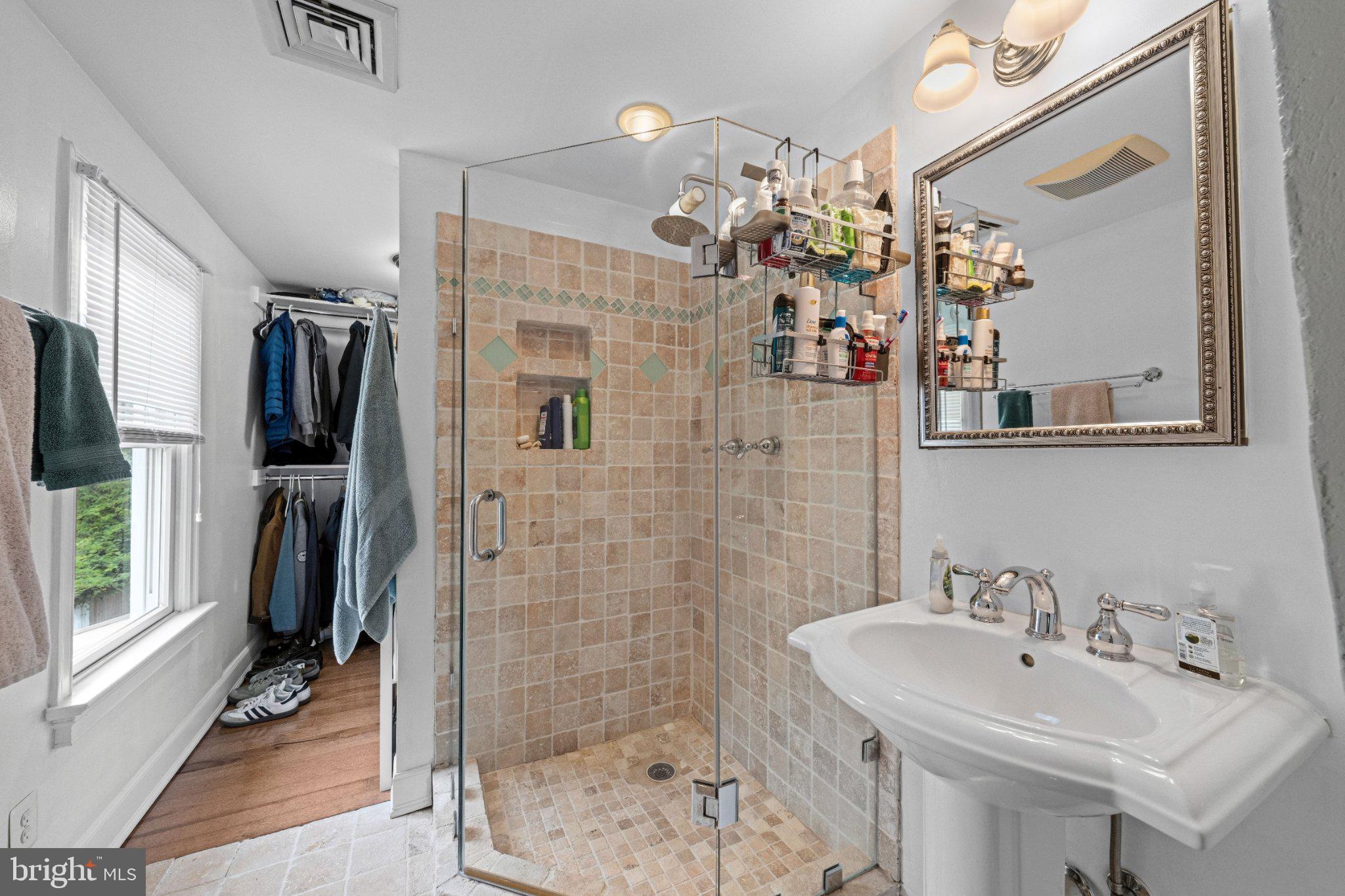 703 Dranesville Road Herndon, VA 20170 - Photo 17 of 35 Elegant glass shower in bright space.