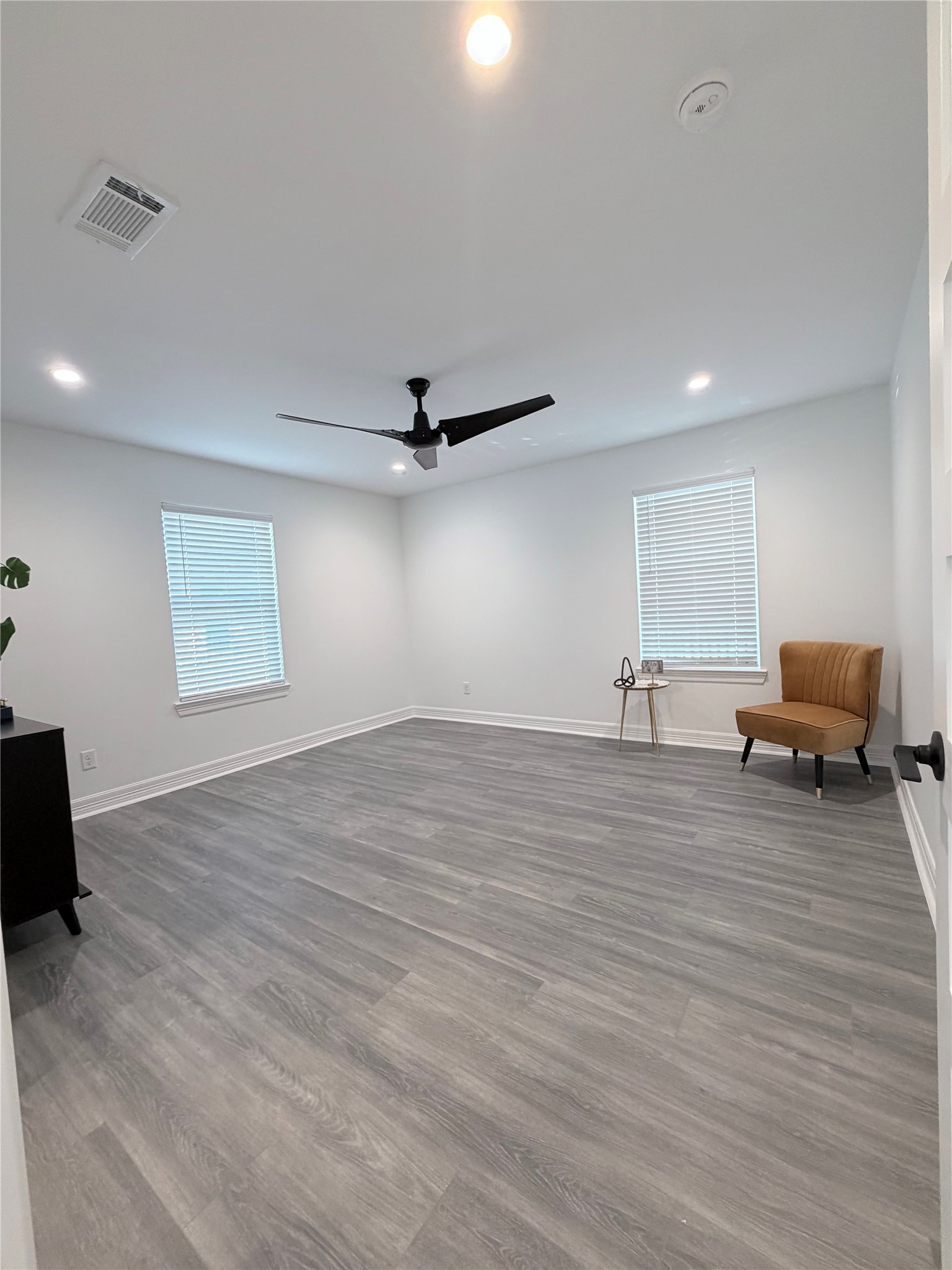 4501 Hirsch Road Houston, TX 77026 - Photo 13 of 30 a view of empty room with wooden floor and fan