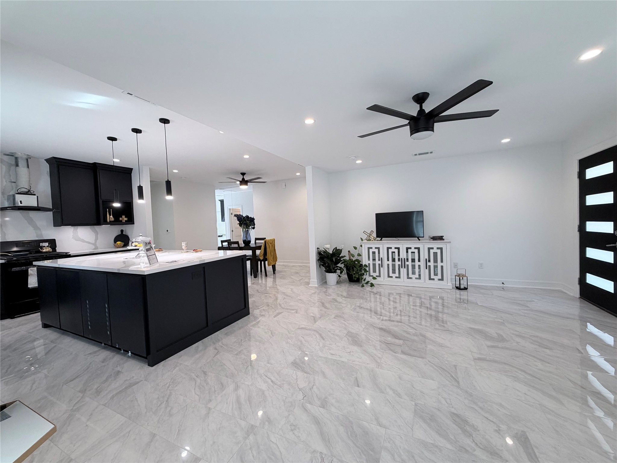 4501 Hirsch Road Houston, TX 77026 - Photo 14 of 30 a living room with stainless steel appliances kitchen island granite countertop a sink and cabinets