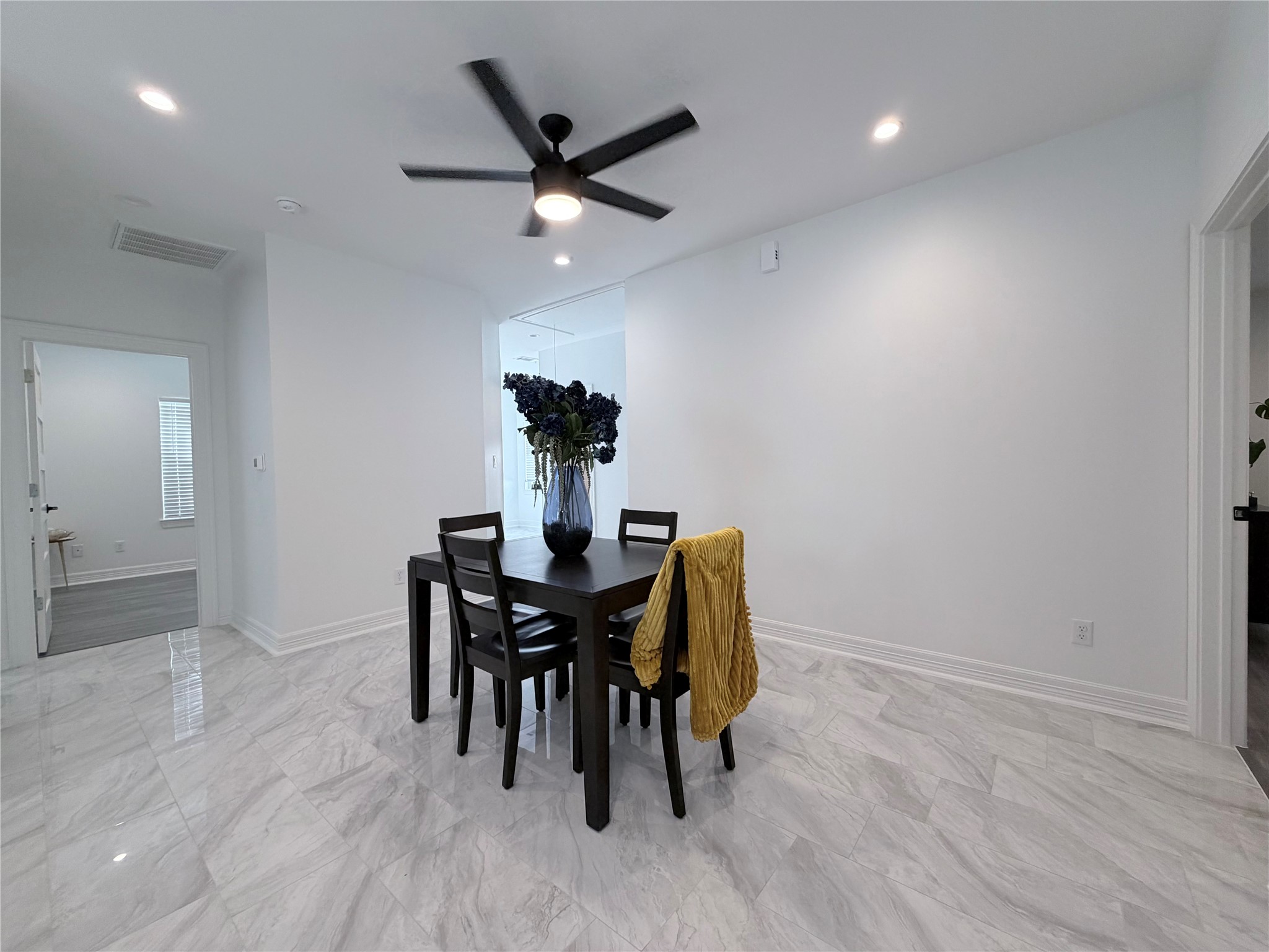 4501 Hirsch Road Houston, TX 77026 - Photo 15 of 30 a view of a dining room with furniture and wooden floor