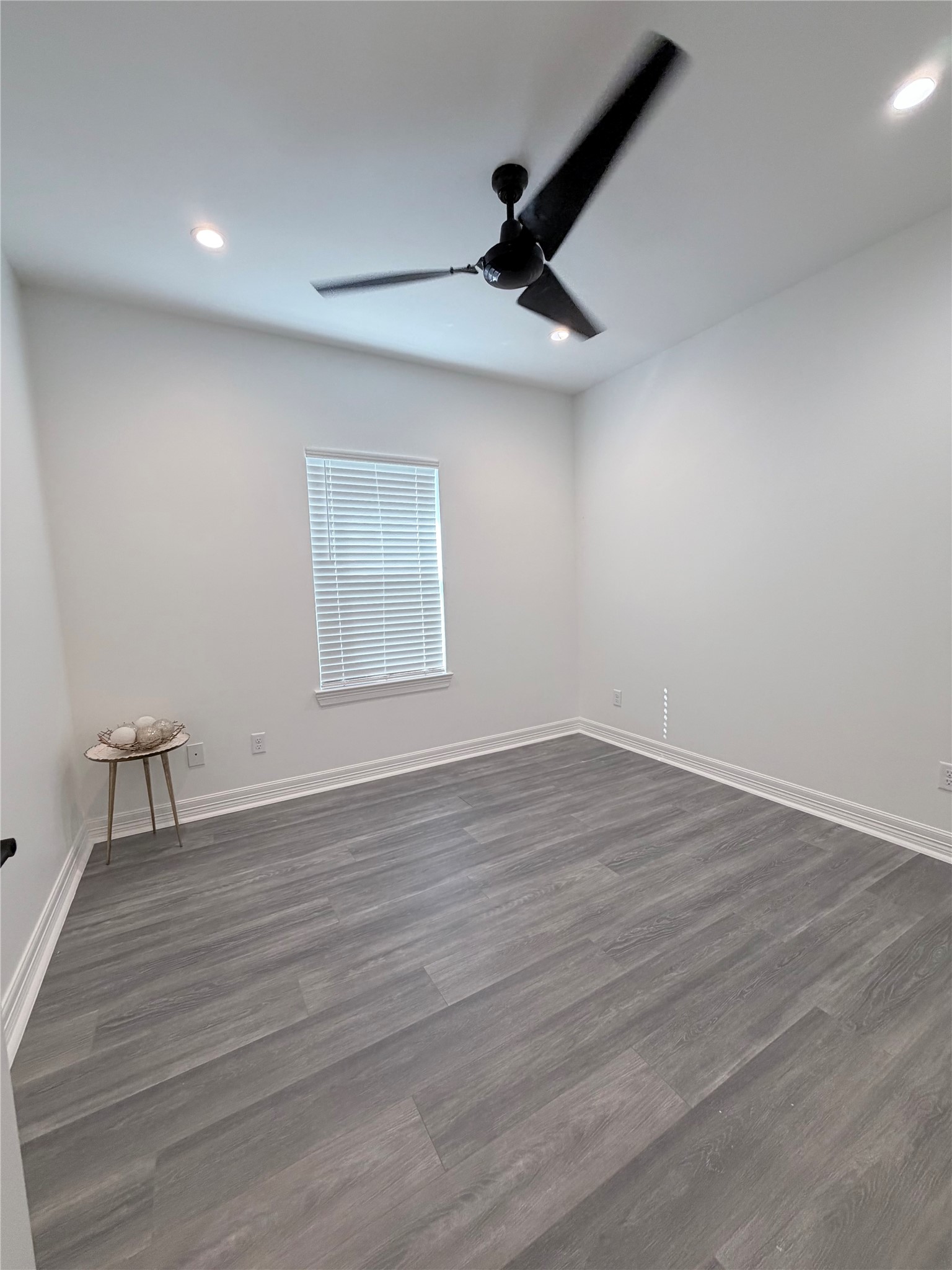 4501 Hirsch Road Houston, TX 77026 - Photo 16 of 30 a view of an empty room with wooden floor and a window