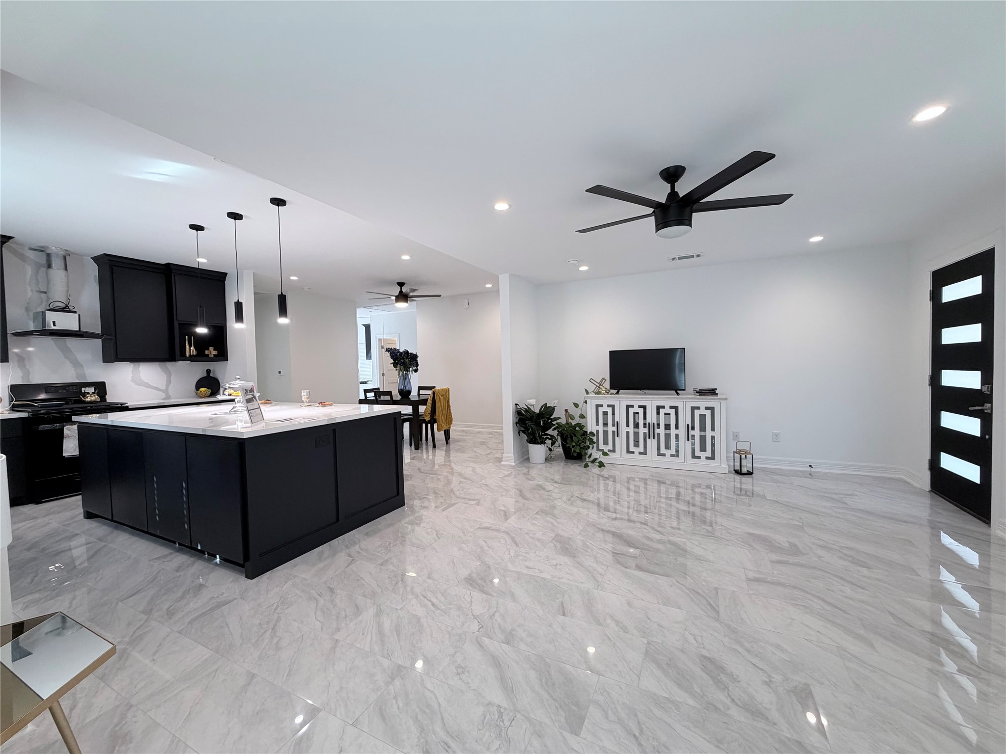 4501 Hirsch Road Houston, TX 77026 - Photo 2 of 30 a living room with stainless steel appliances kitchen island granite countertop a sink and cabinets