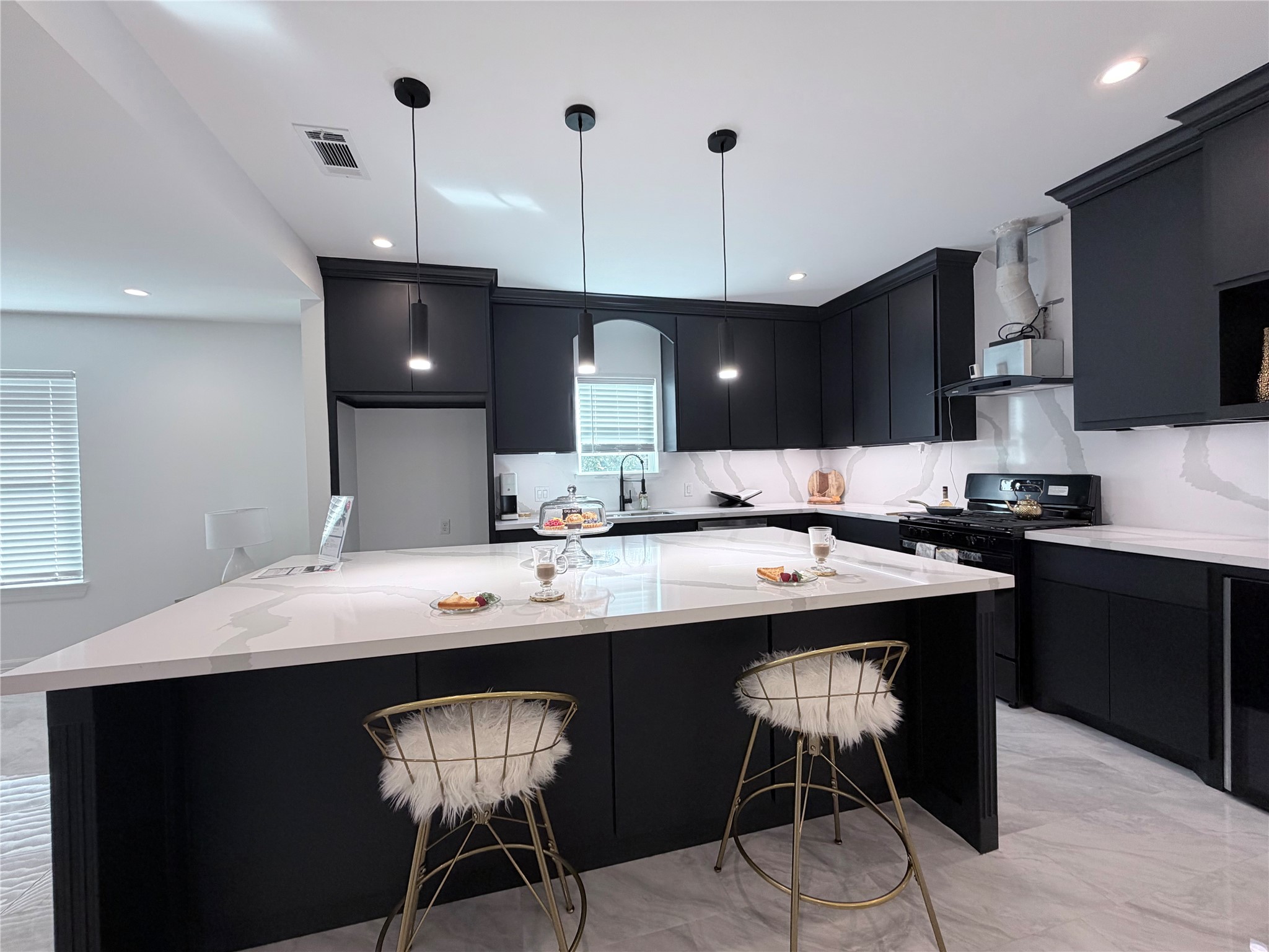 4501 Hirsch Road Houston, TX 77026 - Photo 28 of 30 a kitchen with a dining table chairs and a sink