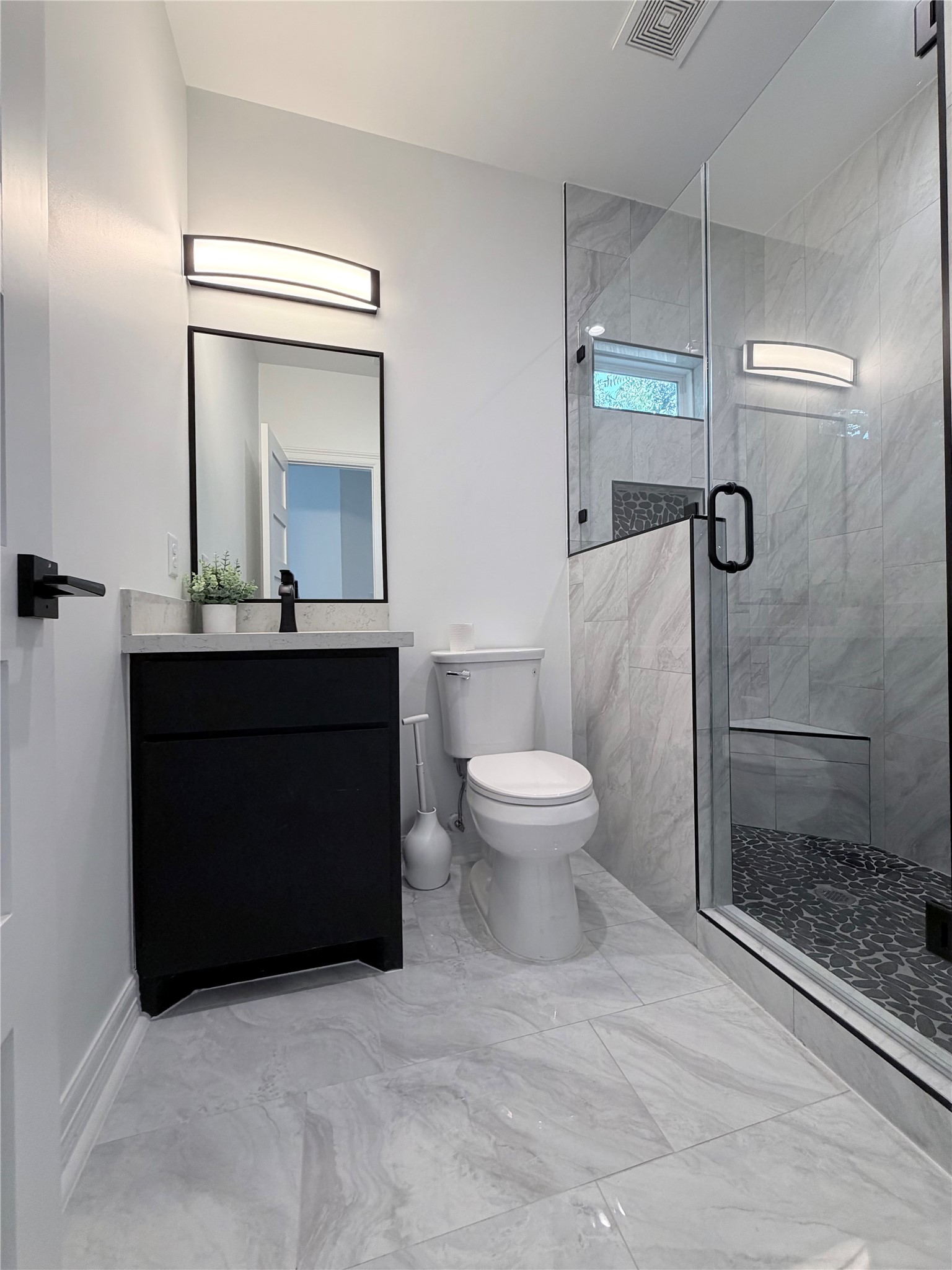 4501 Hirsch Road Houston, TX 77026 - Photo 7 of 30 a bathroom with a sink a toilet and shower