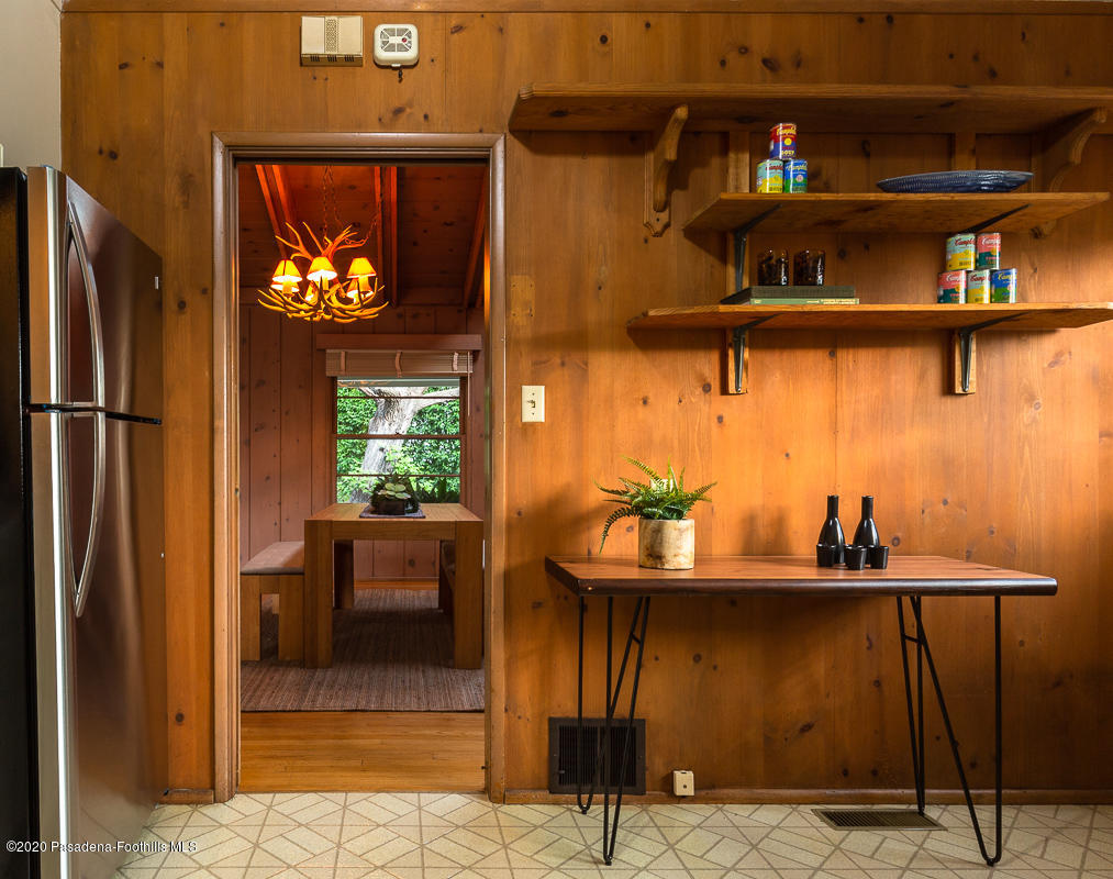 1839 North Arroyo Boulevard Pasadena, CA 91103 - Photo 12 of 36 a kitchen with stainless steel appliances granite countertop a refrigerator and a cabinets