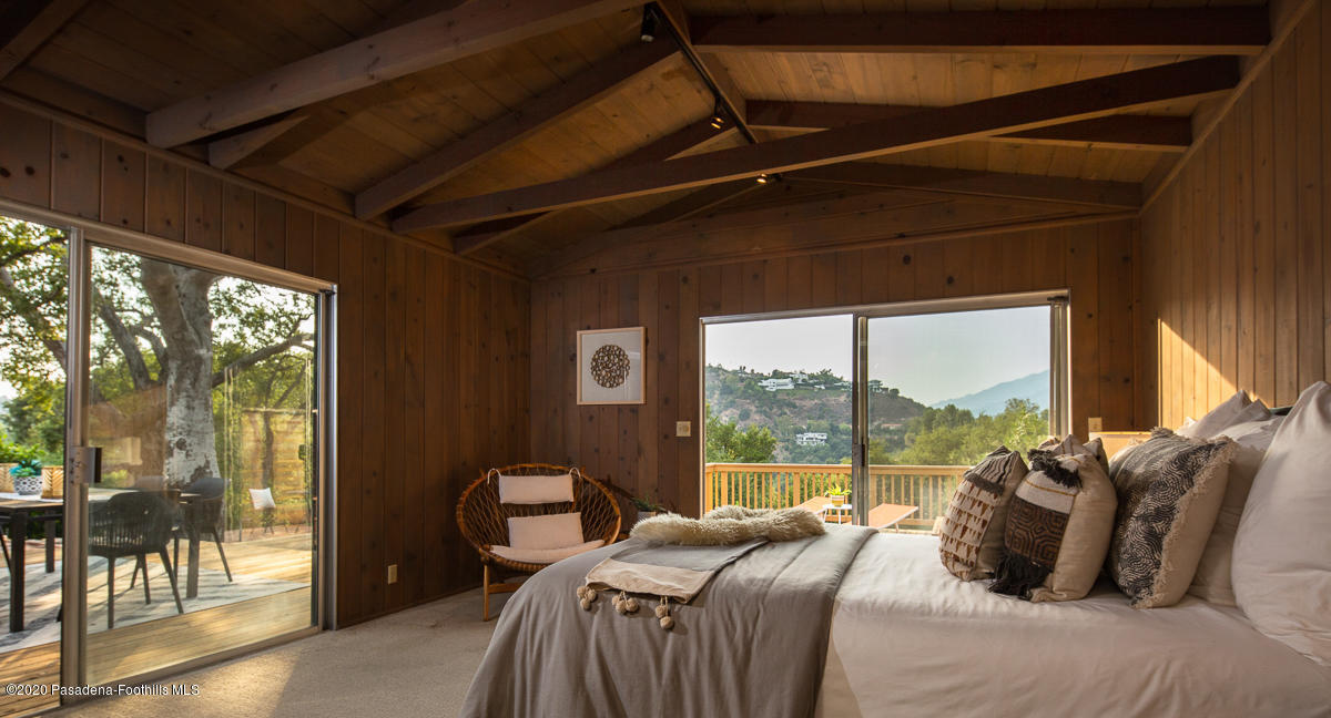 1839 North Arroyo Boulevard Pasadena, CA 91103 - Photo 14 of 36 a bed sitting in a bedroom next to a window