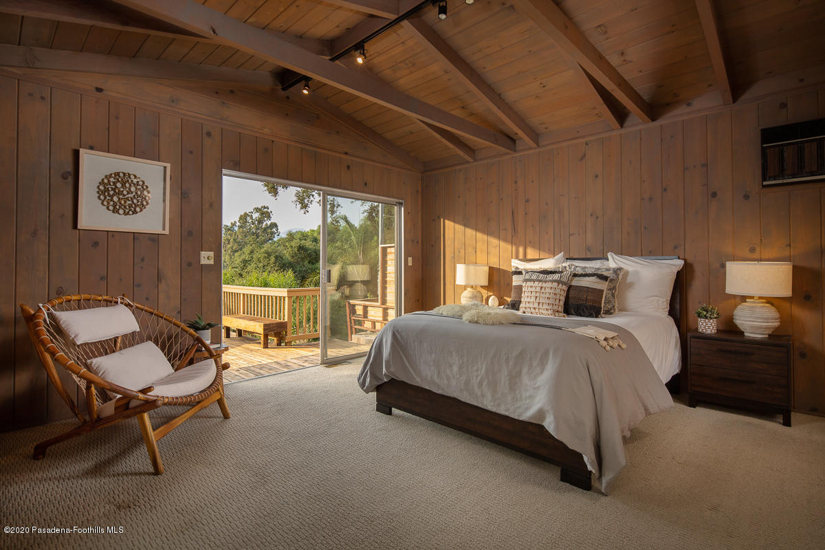 1839 North Arroyo Boulevard Pasadena, CA 91103 - Photo 15 of 36 a spacious bedroom with a bed and a chair