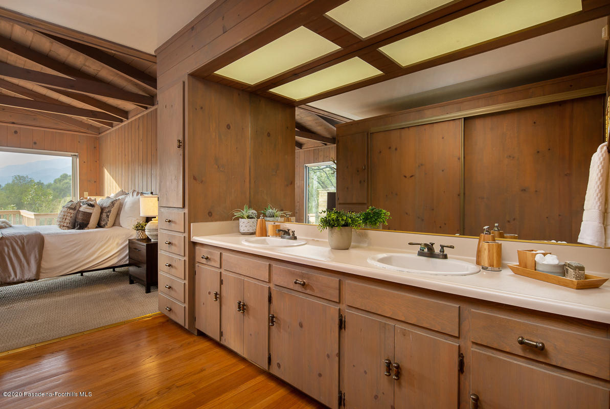 1839 North Arroyo Boulevard Pasadena, CA 91103 - Photo 16 of 36 a spacious bathroom with a double vanity sink and mirror