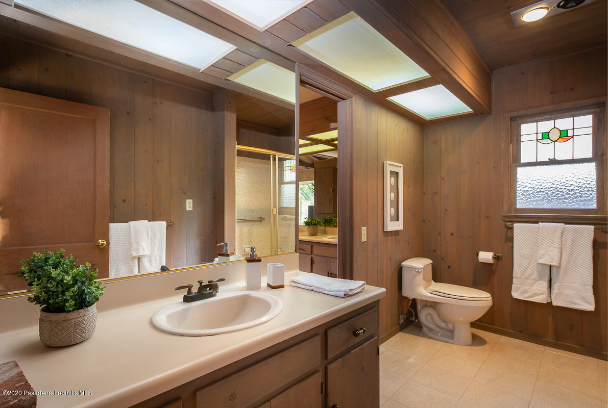 1839 North Arroyo Boulevard Pasadena, CA 91103 - Photo 18 of 36 a bathroom with a toilet sink and mirror