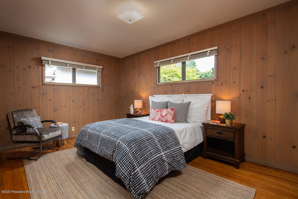 1839 North Arroyo Boulevard Pasadena, CA 91103 - Photo 19 of 36 a bedroom with a bed and wooden floor