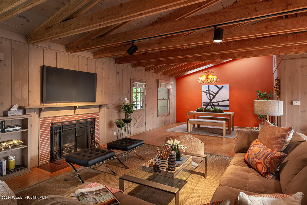 1839 North Arroyo Boulevard Pasadena, CA 91103 - Photo 3 of 36 a living room with furniture a flat screen tv and a fireplace