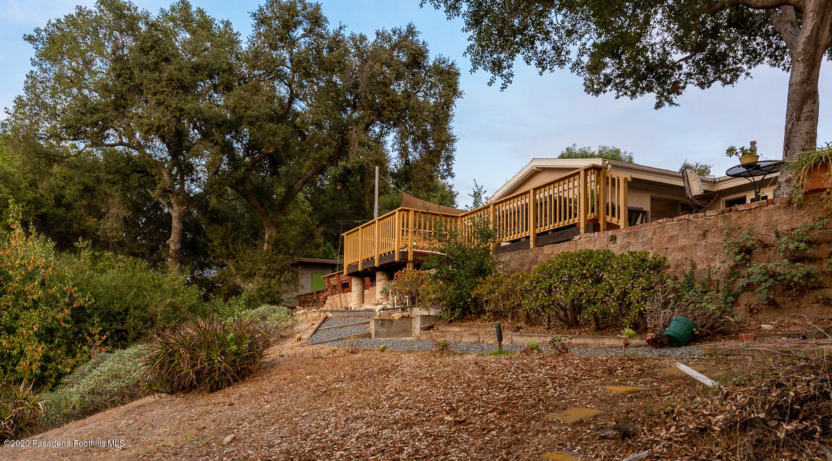 1839 North Arroyo Boulevard Pasadena, CA 91103 - Photo 30 of 36 a white house that has a tree in front of it