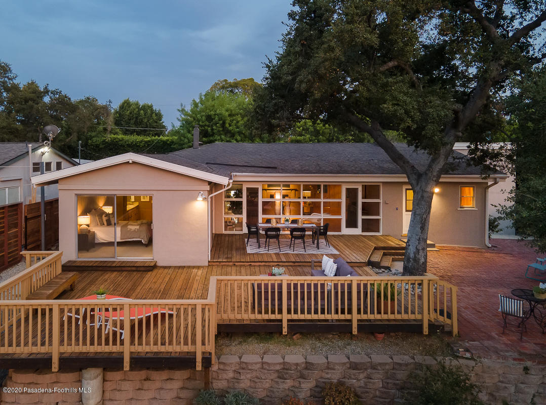 1839 North Arroyo Boulevard Pasadena, CA 91103 - Photo 32 of 36 a view of a house with a wooden deck and a yard