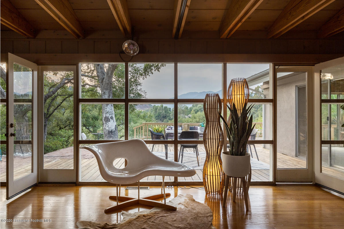 1839 North Arroyo Boulevard Pasadena, CA 91103 - Photo 6 of 36 a view of a furniture window and wooden floor