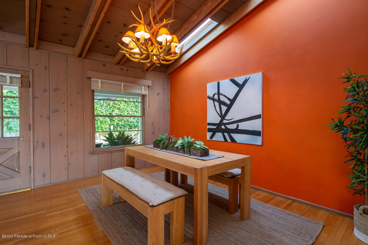 1839 North Arroyo Boulevard Pasadena, CA 91103 - Photo 7 of 36 a view of a dining room with furniture and chandelier