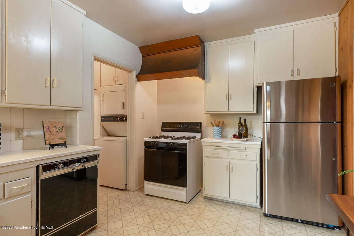 1839 North Arroyo Boulevard Pasadena, CA 91103 - Photo 10 of 36 a kitchen with cabinets and stainless steel appliances