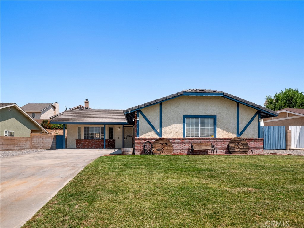 a front view of a house with a yard and porch