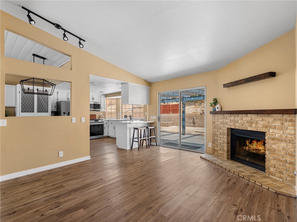 13901 Hidden Valley Road Victorville, CA 92395 - Photo 15 of 31 a living room with furniture and a fireplace