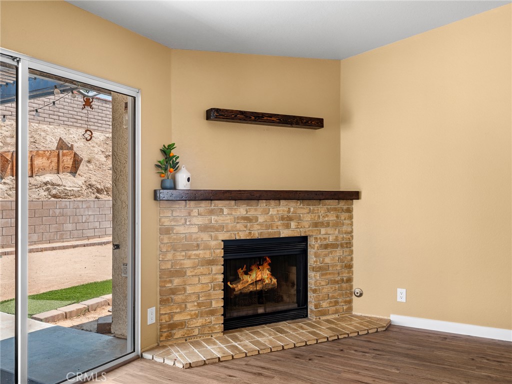 13901 Hidden Valley Road Victorville, CA 92395 - Photo 16 of 31 a living room with a fireplace