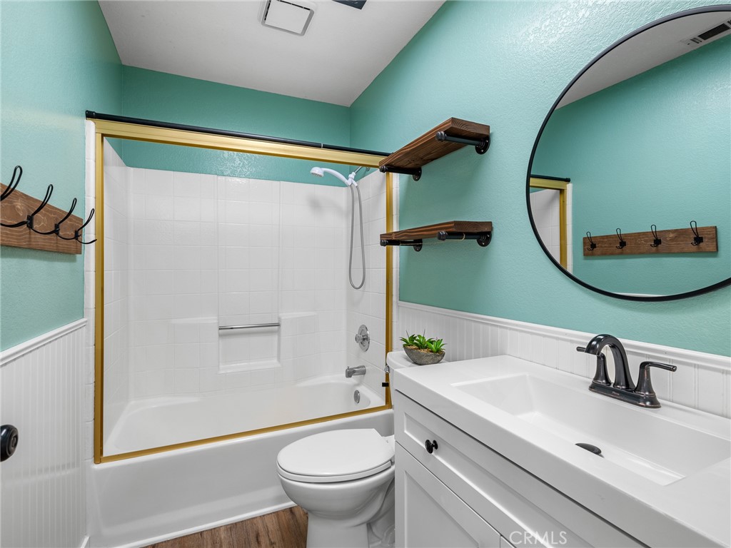 13901 Hidden Valley Road Victorville, CA 92395 - Photo 19 of 31 a bathroom with a sink and mirror