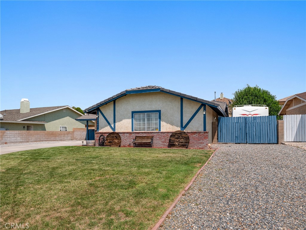 13901 Hidden Valley Road Victorville, CA 92395 - Photo 2 of 31 a view of a house with a yard and deck