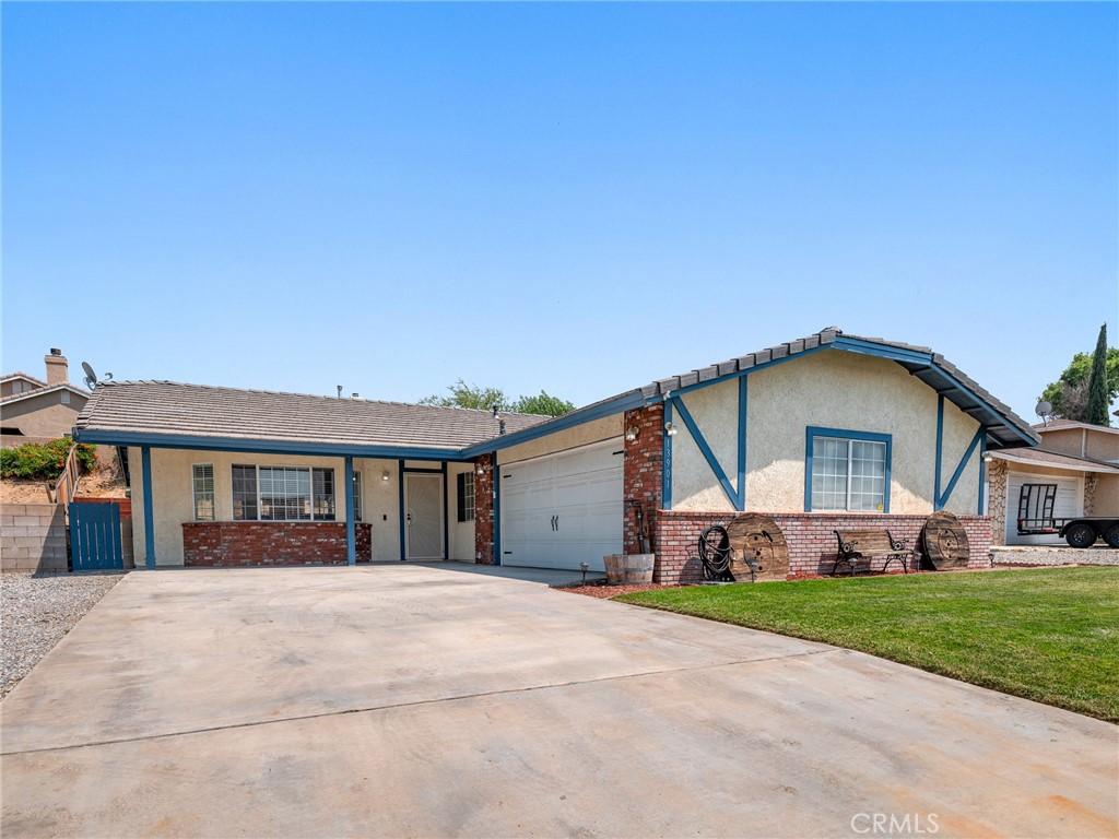 13901 Hidden Valley Road Victorville, CA 92395 - Photo 3 of 31 a view of house and yard with green space