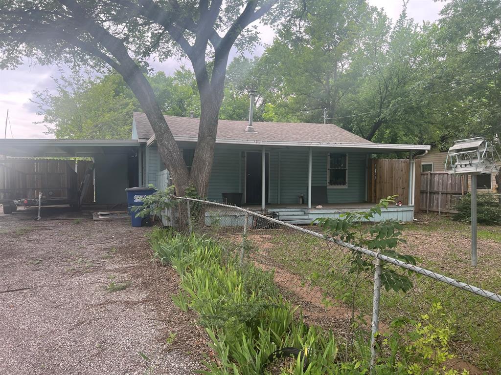 Undisclosed Address Lancaster, TX 75134 - Photo 1 of 1 a backyard of a house with table and chairs
