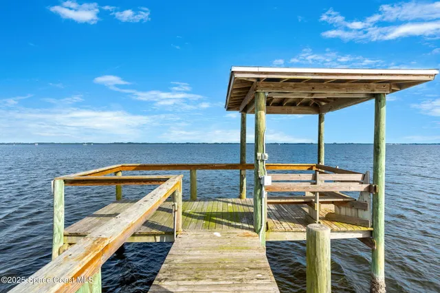 a view of a swimming pool with a yard
